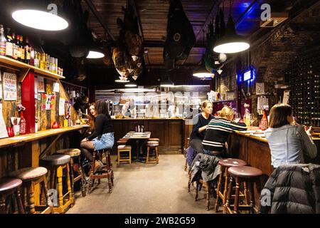 Eclectic interior of Bar Tozino tapas bar in the railway arches of Maltby Street Market, London, England Stock Photo