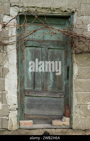 Sunja, Croatia, 05,04,2021: Old wooden rustic door on rural home wall. Stock Photo