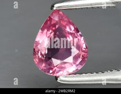 Natural pink sapphire gem on background Stock Photo