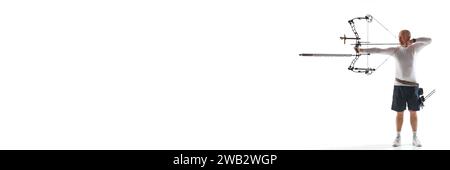 Concentrated man aiming archery bow, practicing isolated over white studio background. Archery sport, competition Stock Photo