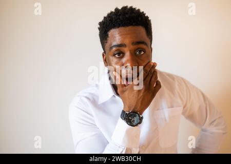 Portrait of young businessman who is shocked. Stock Photo