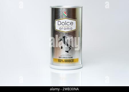 Metal can of ground Italian espresso coffee Dolce Aroma 100% Arabica on a white background with reflection Stock Photo