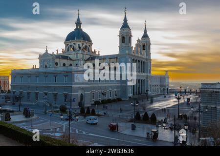 The Almudena Cathedral during a colorful sunset, it is the most important  and Catholic religious building in Madrid and a visit is free of charge exc Stock Photo