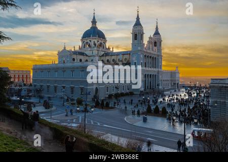 The Almudena Cathedral during a colorful sunset, it is the most important  and Catholic religious building in Madrid and a visit is free of charge exc Stock Photo