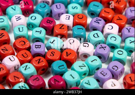 A closeup shot of an array of colorful cubic beads with letters Stock Photo