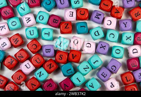 A closeup shot of an array of colorful cubic beads with letters Stock Photo