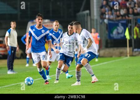 Emanuele Ndoj Of Brescia Calcio FC Contrasted By Mattia Tonetto Of ...