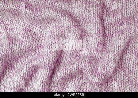 Pink and white color melange knitting cashmere wool cloth texture. Background of crumpled, wrinkled knit fabric,  textile structure, cloth surface, we Stock Photo