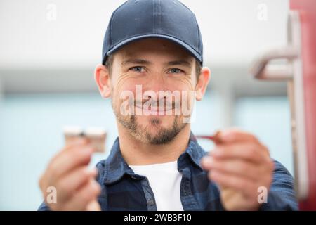 happy male worker smiling at the camera Stock Photo