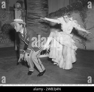 Annalisa Ericson, 1913-2011, Swedish actress and revue performer and one of the big names in Swedish film between the 1930s and 1950s. Here with co-star Nils Poppe during a performance Where is Charley that Södra teatern put on in 1950. Kristoffersson ref BA34-8 Stock Photo