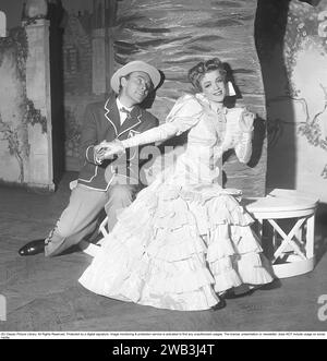 Annalisa Ericson, 1913-2011, Swedish actress and revue performer and one of the big names in Swedish film between the 1930s and 1950s. Here with co-star Nils Poppe during a performance Where is Charley that Södra teatern put on in 1950. Kristoffersson ref BA35-3 Stock Photo
