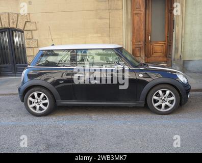 TURIN, ITALY - CIRCA FEBRUARY 2023: Black And White Mini Cooper Car Stock Photo