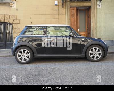 TURIN, ITALY - CIRCA FEBRUARY 2023: Black And White Mini Cooper Car Stock Photo