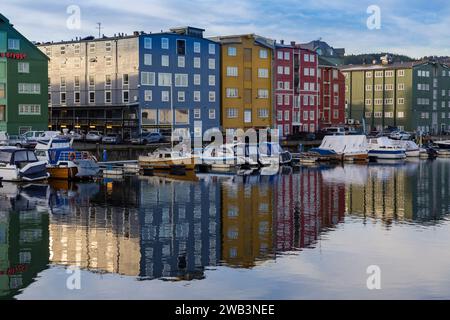 reflections of colourful waterfront warehouses wharfs buildings of Bakklandet in river Nidelva at Trondheim, Norway, Scandinavia, Europe in October Stock Photo