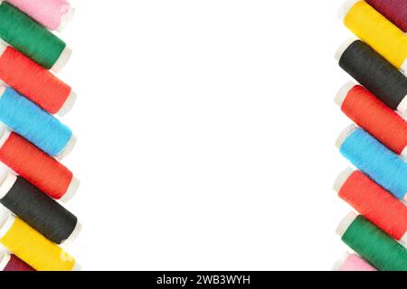 Colorful frame of sewing thread isolated on a white background. Free space for text. Stock Photo
