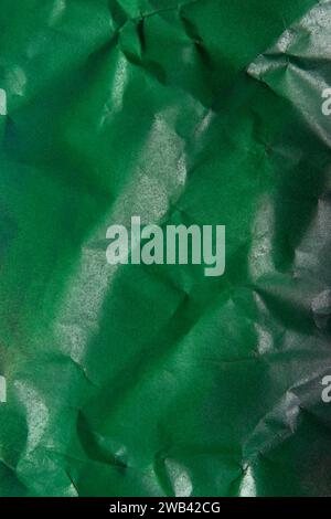 crumpled krantf paper painted green with spray paint Stock Photo