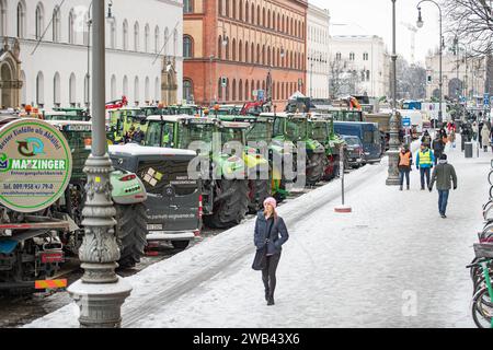 Munich, Germany. 08th Jan, 2024. On 8 January 2024, thousands of farmers, gathered on Odeonsplatz in Munich, Germany to protest against the austerity plans and the removal of subsidies of the so called traffic light government in the agricultuer sector. Many of them arrived by tractor, which were parked along Ludwigsstrasse and Leopoldstrasse from Odeonsplatz. Protests are planned throughout Germany for the whole week. (Photo by Alexander Pohl/Sipa USA) Credit: Sipa USA/Alamy Live News Stock Photo