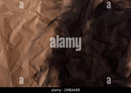 crumpled krantf paper gradation painted black with spray paint Stock Photo