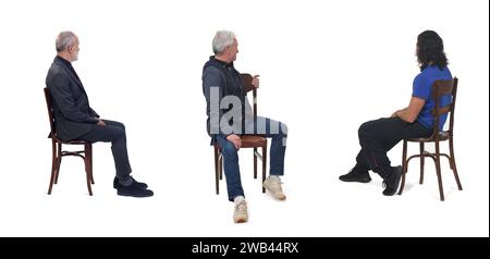 group of people sitting on chair and looking back on white background Stock Photo