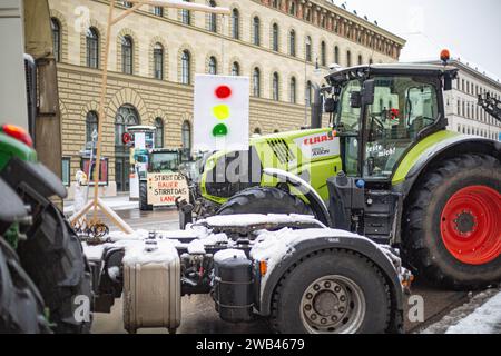 Munich, Germany. 08th Jan, 2024. On 8 January 2024, thousands of farmers, gathered on Odeonsplatz in Munich, Germany to protest against the austerity plans and the removal of subsidies of the so called traffic light government in the agricultuer sector. Many of them arrived by tractor, which were parked along Ludwigsstrasse and Leopoldstrasse from Odeonsplatz. Protests are planned throughout Germany for the whole week. (Photo by Alexander Pohl/Sipa USA) Credit: Sipa USA/Alamy Live News Stock Photo