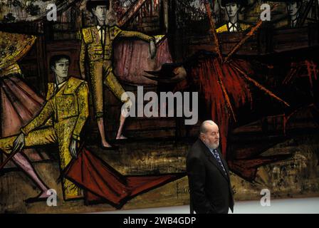 Bernard Buffet French artist expressionist painter (1928-1999) With signature painting of Matadors at a Bull Fight, at his one person exhibition Kassal Germany. 1994 1990s HOMER SYKES Stock Photo