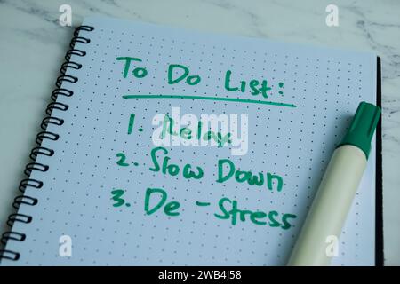 Concept of To Do List write on book with keywords isolated on Wooden Table. Stock Photo