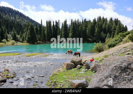 August 31 2023 - Semyonovka, Kyrchyn Valley in Kyrgyzstan: People enjoy the nature in the north of Kyrgyzstan mountains Stock Photo