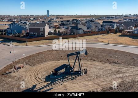 Frederick, Colorado - An oil well near a housing subdivision on Colorado's front range. Stock Photo