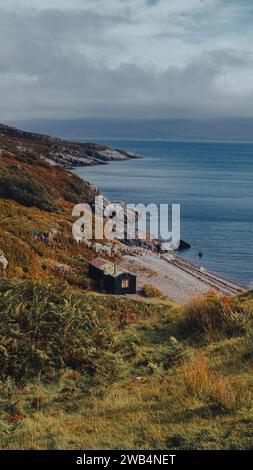 Isolated hut on a small beach, located in Brochel, on the Isle of Rassay Stock Photo