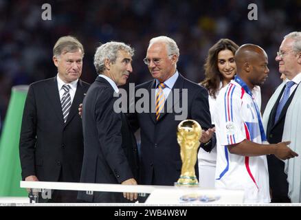 Football Legend FRANZ BECKENBAUER passed away on 7th January 2024 - French coach Raymond Domenech get's the honors from German Franz Beckenbauer after the team finishes second in the Soccer World Cup 2006. World Soccer final in Berlin Germany on Sunday July 9th 2006. Italy is World Champion after penalty shoot out. - Result of the match 1:1 and after the penalty shoot out 5:3 - FIFA Football World Cup Finale Berlin 9.07.2006: Frankreich - Italien - Fuﬂball-WM Finale - Fuﬂball - Football - Fussball - Italien ist Fussball Weltmeister 2006 nach 1:1 und nach 11 Meterschieﬂen 5:3 - Copyright Stock Photo