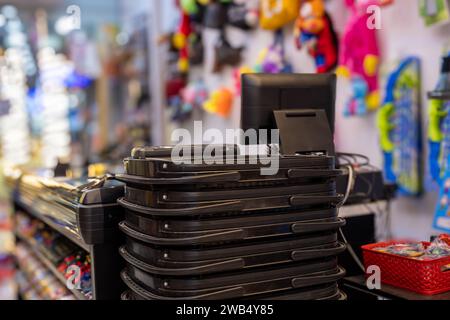 Shopping cart with cashier PC screen in the background for gift sore Stock Photo