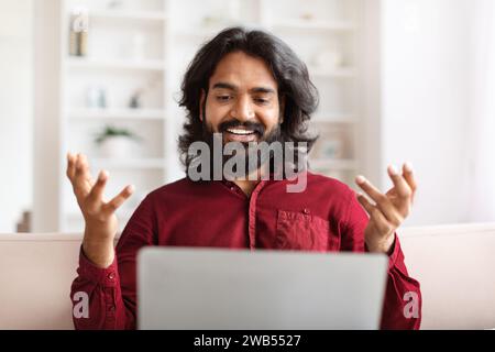 Portrait bearded young indian man have video call on laptop Stock Photo