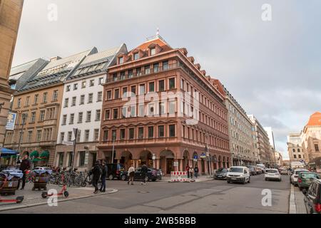 Berlin, Germany - DEC 20, 2021: Office buildings and stores on Friedrichstrasse, one of the main attraction areas in the central Mitte district of Ber Stock Photo