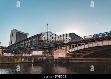 Berlin, Germany - 17 DEC 2021: Friedrichstrasse railway bridge over the Spree River in Berlin, Germany. Stock Photo