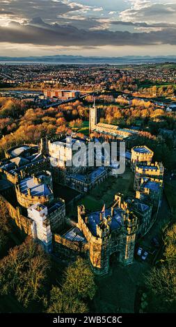 Aerial view of a historic Lancaster castle amidst a sprawling cityscape ...