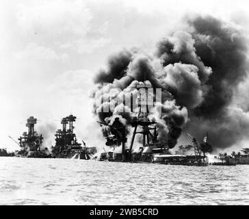Attack on Pearl Harbor, Aftermath of a Japanese attack on three stricken U.S. battleships,: 1941 Stock Photo