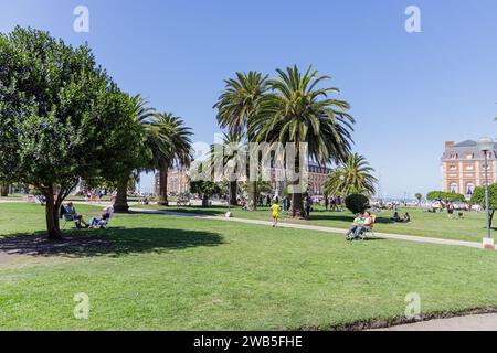 Mar del Plata, Argentina - December 30th, 2023: People resting in the Plaza Colon in Mar del Plata. Stock Photo