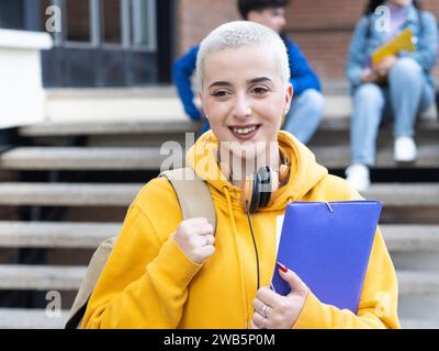Portrait of a young alternative student with short hair on a campus Stock Photo