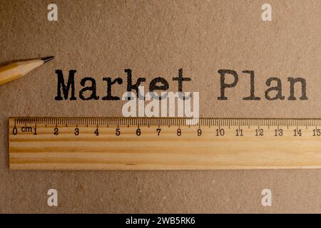 Text MARKETING PLAN written on a Notepad on a business or financial topic. Top view of the calculator, documents, and desktop.Business concept Stock Photo