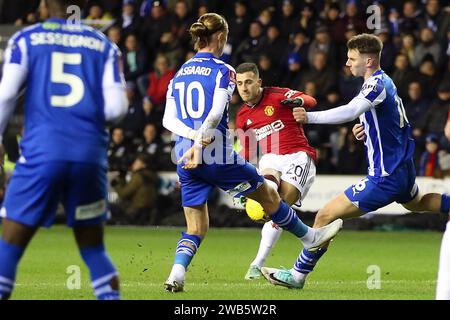 Wigan, UK. 08th Jan, 2024. Diogo Dalot of Manchester United (20) shoots and scores his teams 1st goal. Emirates FA Cup, 3rd round match, Wigan Athletic v Manchester Utd at the DW Stadium in Wigan, Lancs on Monday 8th January 2024. this image may only be used for Editorial purposes. Editorial use only, pic by Chris Stading/Andrew Orchard sports photography/Alamy Live news Credit: Andrew Orchard sports photography/Alamy Live News Stock Photo