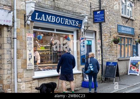 Stow on the Wold market town in the Cotswolds and local butcher Lambournes, butcher talking to customers, Gloucestershire,England,UK,2023 Stock Photo