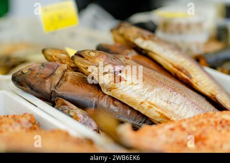 Selection of assorted home made smoked fish on a farmers market in ...