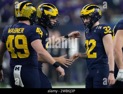 Houston, United States. 08th Jan, 2024. Michigan Wolverines place kicker James Turner (32) is congratulated by teammates after kicking a 31 yard field goal against the Washington Huskies in the second quarter during the 2024 College Football Playoff National Championship at NRG Stadium in Houston, Texas on Monday, January 8, 2024. Photo by Kevin M. Cox/UPI Credit: UPI/Alamy Live News Stock Photo