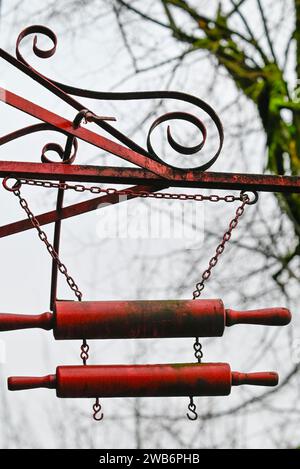 rolling pins part of hanging sign Stock Photo