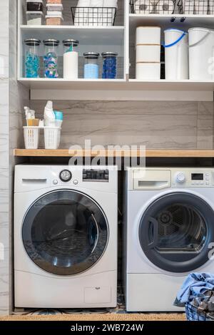 White bathroom laundry comfortable storage organizing arrangement on shelves eco style minimalism Stock Photo