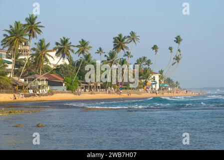 HIKKADUWA, SRI LANKA - FEBRUARY 20, 2020: Wewala beach on a sunny day Stock Photo