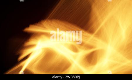 Abstract interpretation of bright and glowing motion blurred orange flames on black background. Full frame modern and dynamic background, copy space. Stock Photo