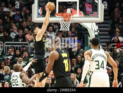 Milwaukee, USA. 9th Jan, 2024. Utah Jazz forward Simone Fontecchio (top) dunks during the NBA regular season game between Milwaukee Bucks and Utah Jazz in Milwaukee, the United States, Jan. 9, 2024. Credit: Joel Lerner/Xinhua/Alamy Live News Stock Photo