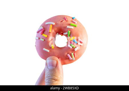 pink doughnut in woman's hand Stock Photo