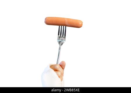 Female hand hold fork with sausage isolated on white background Stock Photo